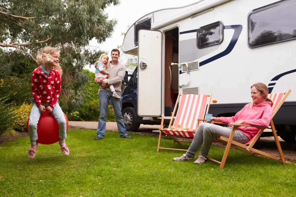 family happily camping at rv park on whiskey road