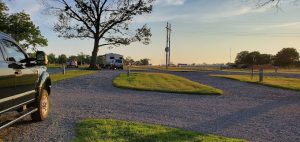 backing black truck rv hookup into parking space 